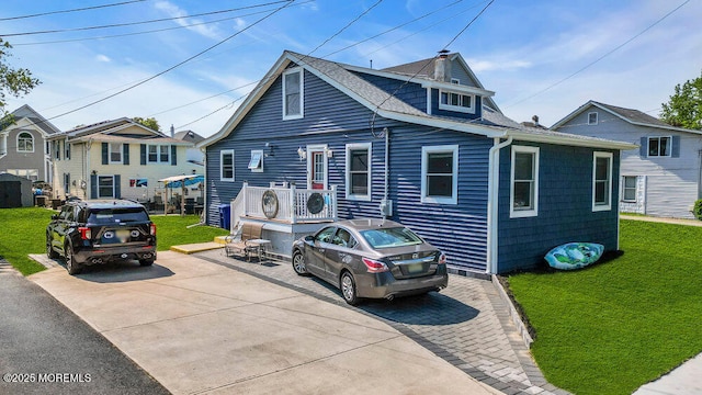 1208 Pine Tree Way, Belmar, NJ 07719 - view of front of home with a front yard and a shingled roof