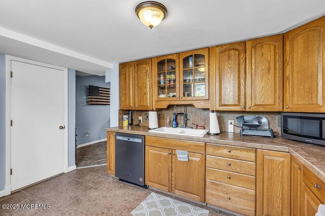 1208 Pine Tree Way, Belmar, NJ 07719 - kitchen with dishwasher, a sink, baseboards, backsplash, and glass insert cabinets