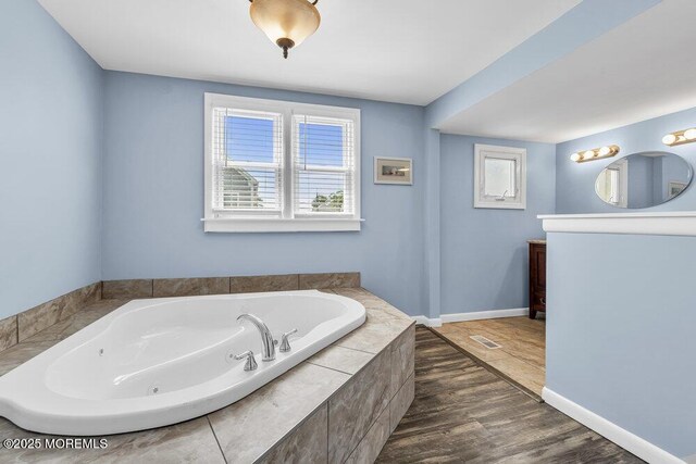 1208 Pine Tree Way, Belmar, NJ 07719 - full bath with a jetted tub, wood finished floors, vanity, and baseboards