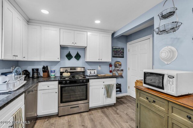1208 Pine Tree Way, Belmar, NJ 07719 - kitchen with gas stove, white microwave, white cabinets, light wood finished floors, and recessed lighting