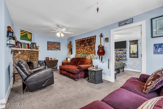 1208 Pine Tree Way, Belmar, NJ 07719 - carpeted living area with ceiling fan, a stone fireplace, and baseboards