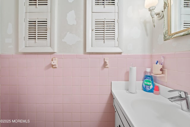 1920 W Lake Ave, Neptune Township, NJ 07753 - bathroom featuring vanity, tile walls, and wainscoting