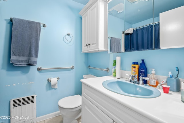 1920 W Lake Ave, Neptune Township, NJ 07753 - full bath with radiator, vanity, toilet, curtained shower, and tile patterned flooring
