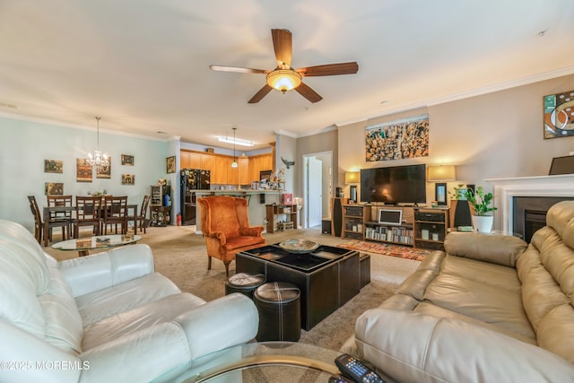 326 Sloan Ct, Matawan, NJ 07747 - living area with light colored carpet, crown molding, ceiling fan, a chandelier, and a fireplace