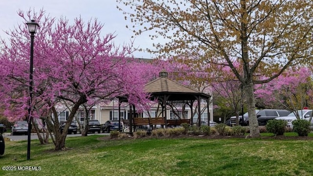 326 Sloan Ct, Matawan, NJ 07747 - rear view of house featuring a gazebo and a lawn