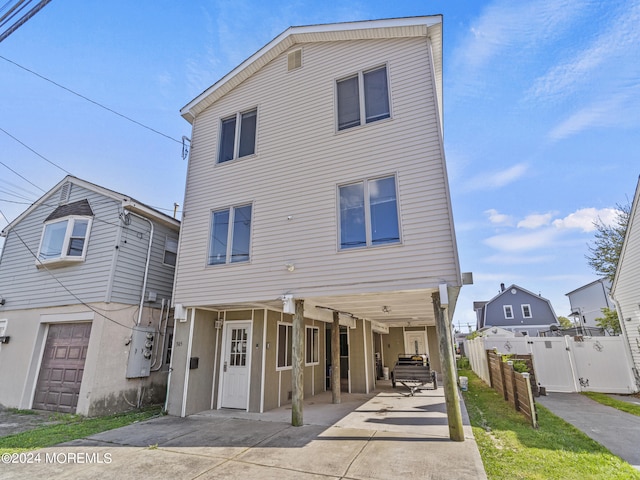305 Franklin Ave, Seaside Heights, NJ 08751 - view of front of home featuring a carport, concrete driveway, and a patio area