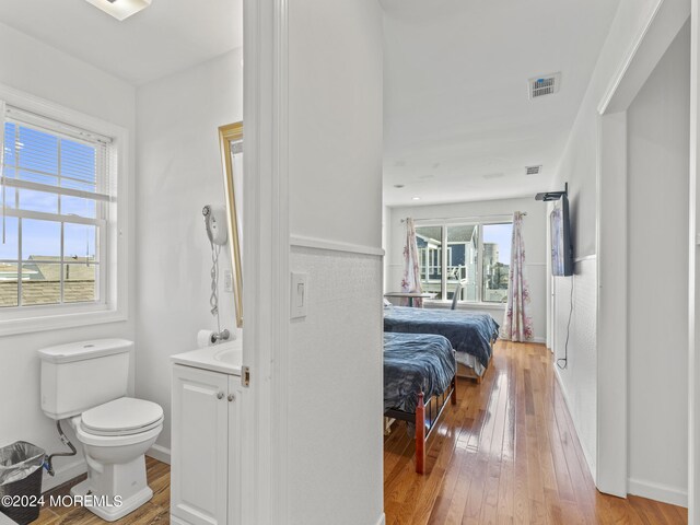305 Franklin Ave, Seaside Heights, NJ 08751 - bathroom with toilet, hardwood / wood-style flooring, vanity, and baseboards