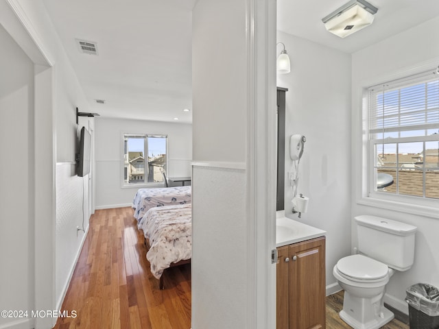 305 Franklin Ave, Seaside Heights, NJ 08751 - bathroom with vanity, wood finished floors, toilet, and baseboards