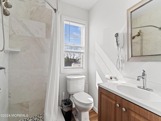 305 Franklin Ave, Seaside Heights, NJ 08751 - bathroom featuring vanity, tiled shower, and toilet