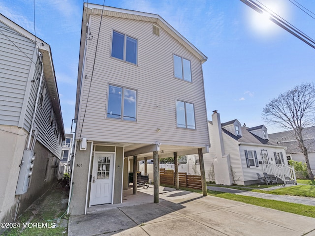 305 Franklin Ave, Seaside Heights, NJ 08751 - view of front of house with a carport, concrete driveway, and a patio area
