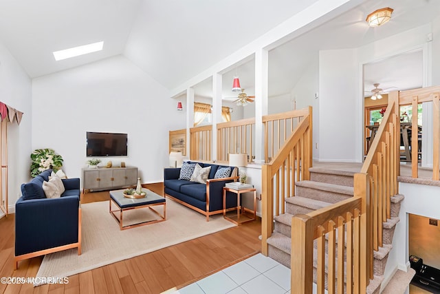35 High Ridge Rd, Ocean Twp, NJ 07712 - living room featuring a ceiling fan, a skylight, stairway, wood finished floors, and high vaulted ceiling
