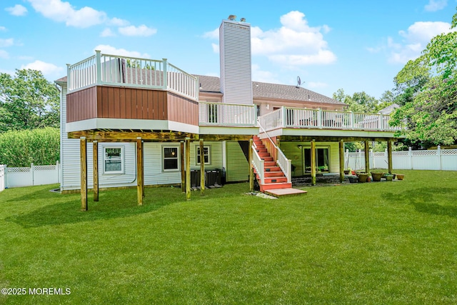 35 High Ridge Rd, Ocean Twp, NJ 07712 - back of property featuring a fenced backyard, a deck, a chimney, and stairs