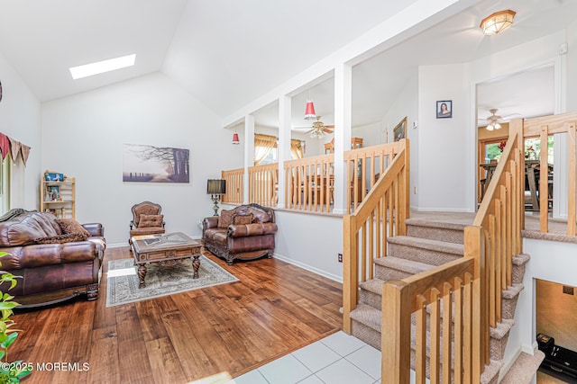 35 High Ridge Rd, Ocean Twp, NJ 07712 - tiled living room featuring ceiling fan, stairway, vaulted ceiling, and a skylight