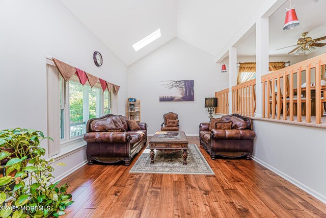 35 High Ridge Rd, Ocean Twp, NJ 07712 - living room featuring a skylight, healthy amount of natural light, a ceiling fan, wood finished floors, and high vaulted ceiling