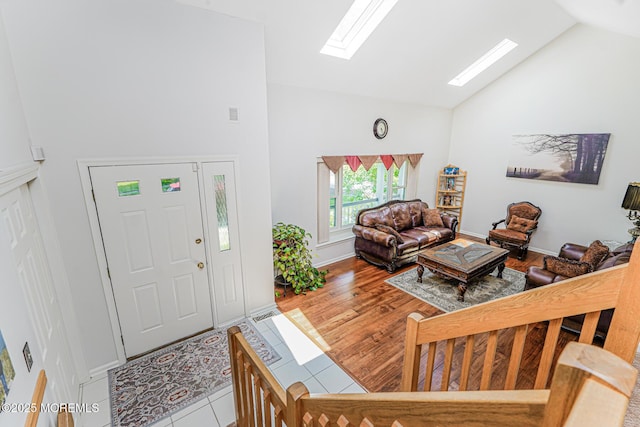 35 High Ridge Rd, Ocean Twp, NJ 07712 - foyer entrance with high vaulted ceiling, a skylight, and tile patterned floors