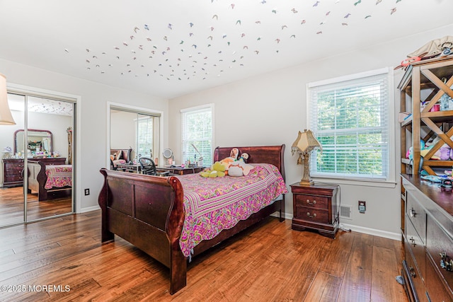 35 High Ridge Rd, Ocean Twp, NJ 07712 - bedroom with hardwood / wood-style flooring, multiple windows, and two closets