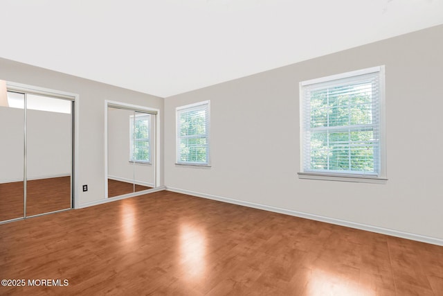 35 High Ridge Rd, Ocean Twp, NJ 07712 - unfurnished bedroom featuring wood finished floors and multiple closets
