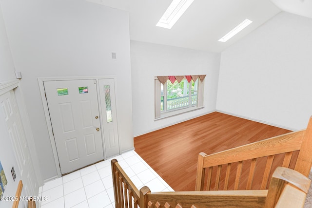 35 High Ridge Rd, Ocean Twp, NJ 07712 - foyer entrance with vaulted ceiling, a skylight, and light tile patterned floors