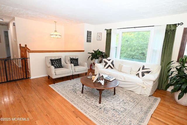 8 Michelle Ave, South Amboy, NJ 08879 - living area with light wood-style flooring, a chandelier, and baseboards