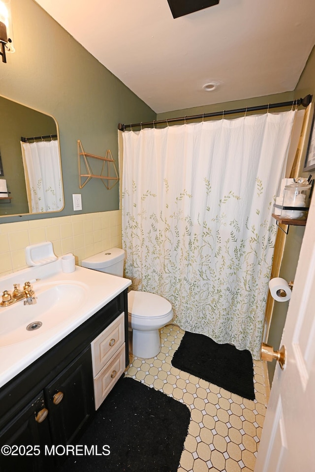 8 Michelle Ave, South Amboy, NJ 08879 - full bathroom featuring tile walls, vanity, toilet, wainscoting, and curtained shower