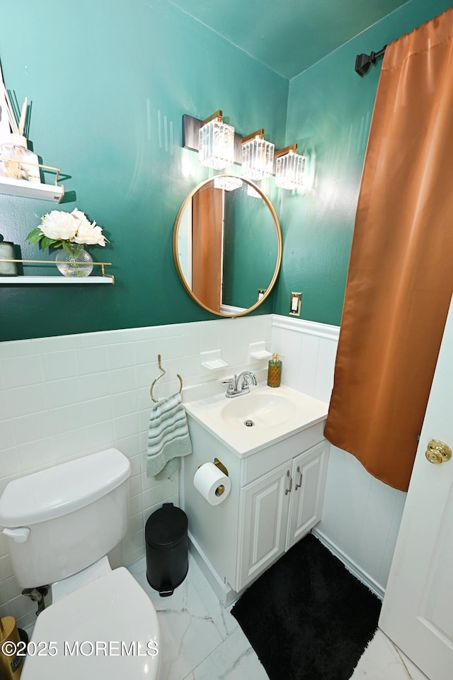 8 Michelle Ave, South Amboy, NJ 08879 - bathroom featuring vanity, toilet, wainscoting, and marble look tile flooring