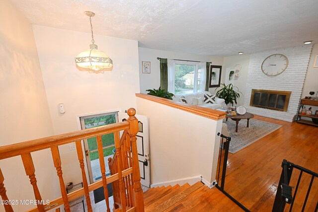 8 Michelle Ave, South Amboy, NJ 08879 - stairway featuring hardwood / wood-style floors and a brick fireplace