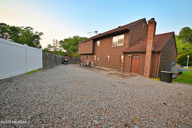 8 Michelle Ave, South Amboy, NJ 08879 - rear view of property with a chimney, a patio, and roof with shingles