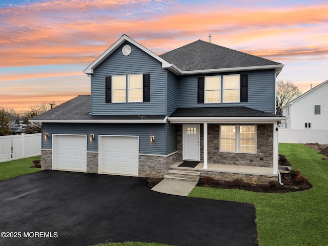 559 Holmdel Rd, Hazlet, NJ 07730 - view of front facade with stone siding, roof with shingles, driveway, and a porch