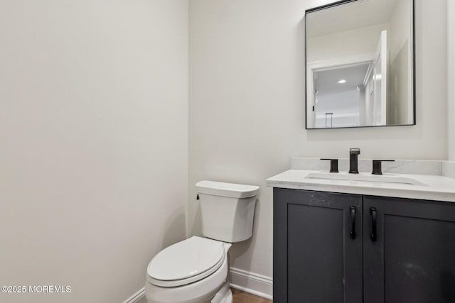 559 Holmdel Rd, Hazlet, NJ 07730 - bathroom featuring baseboards, vanity, and toilet