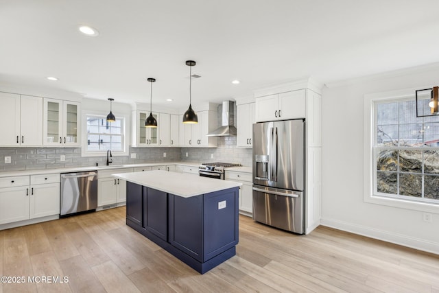 559 Holmdel Rd, Hazlet, NJ 07730 - kitchen featuring appliances with stainless steel finishes, wall chimney range hood, a sink, baseboards, and decorative backsplash