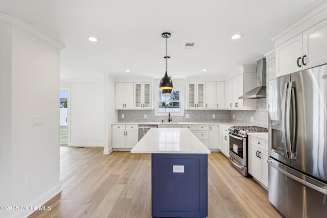 559 Holmdel Rd, Hazlet, NJ 07730 - kitchen featuring stainless steel appliances, wall chimney exhaust hood, a sink, baseboards, and decorative backsplash
