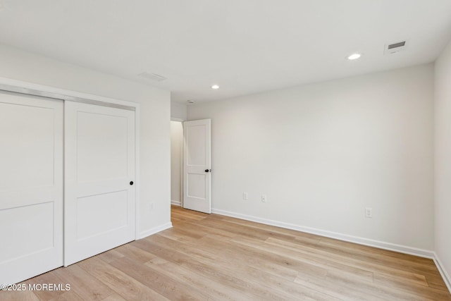 559 Holmdel Rd, Hazlet, NJ 07730 - unfurnished bedroom with baseboards, light wood-type flooring, recessed lighting, and a closet