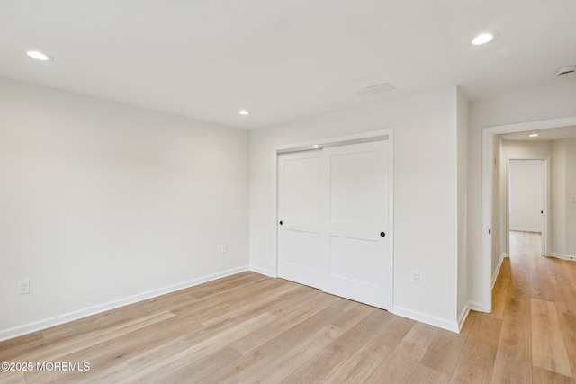 559 Holmdel Rd, Hazlet, NJ 07730 - unfurnished bedroom with light wood-style flooring, recessed lighting, a closet, and baseboards