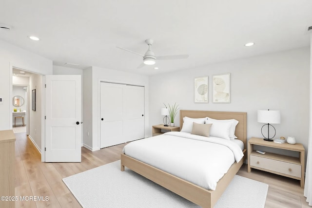 559 Holmdel Rd, Hazlet, NJ 07730 - bedroom with a closet, light wood-style floors, recessed lighting, a ceiling fan, and baseboards