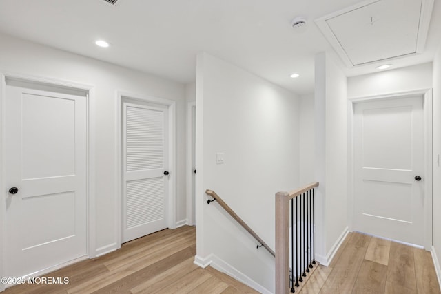 559 Holmdel Rd, Hazlet, NJ 07730 - corridor with an upstairs landing, light wood finished floors, attic access, recessed lighting, and baseboards