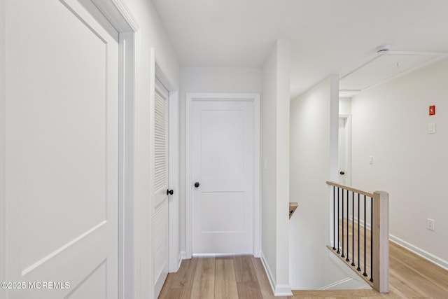 559 Holmdel Rd, Hazlet, NJ 07730 - hall featuring an upstairs landing, light wood-style flooring, and baseboards