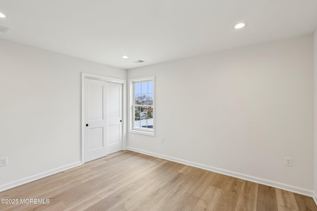 559 Holmdel Rd, Hazlet, NJ 07730 - unfurnished bedroom with light wood finished floors, recessed lighting, baseboards, and a closet