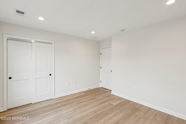559 Holmdel Rd, Hazlet, NJ 07730 - unfurnished bedroom featuring baseboards, light wood-type flooring, recessed lighting, and a closet