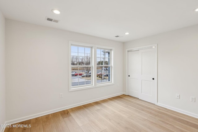 559 Holmdel Rd, Hazlet, NJ 07730 - unfurnished bedroom with light wood-style floors, baseboards, a closet, and recessed lighting