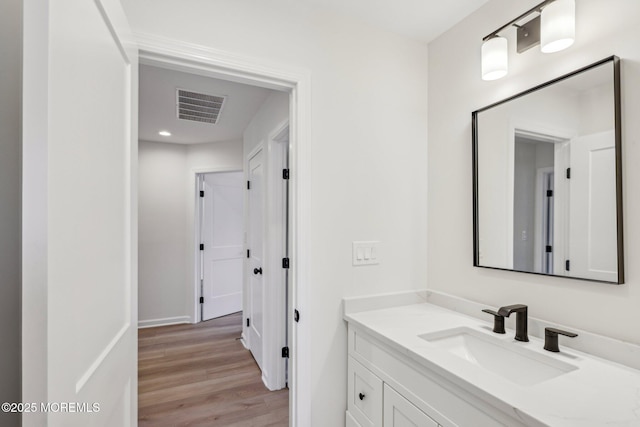 559 Holmdel Rd, Hazlet, NJ 07730 - bathroom with vanity, wood finished floors, baseboards, and recessed lighting
