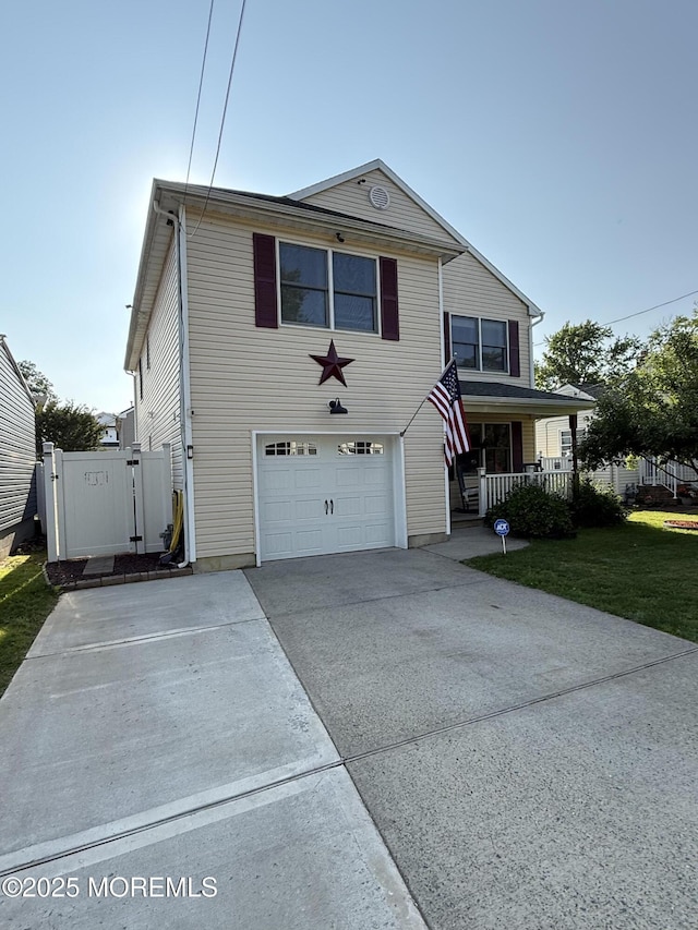 27 Pacific Ave, North Middletown, NJ 07748 - traditional home with a garage, covered porch, and driveway