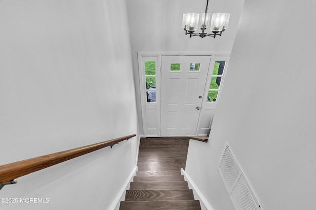 711 Chelsea St, Forked River, NJ 08731 - entrance foyer featuring a chandelier, dark wood-style floors, and baseboards