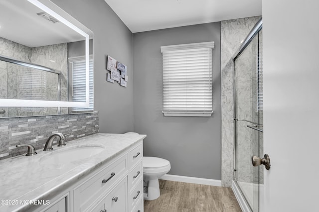 711 Chelsea St, Forked River, NJ 08731 - full bathroom with vanity, toilet, a shower stall, and wood finished floors