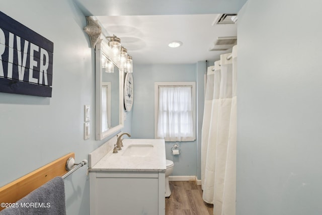 1592 W Front St, Lincroft, NJ 07738 - bathroom featuring vanity, toilet, wood finished floors, baseboards, and curtained shower