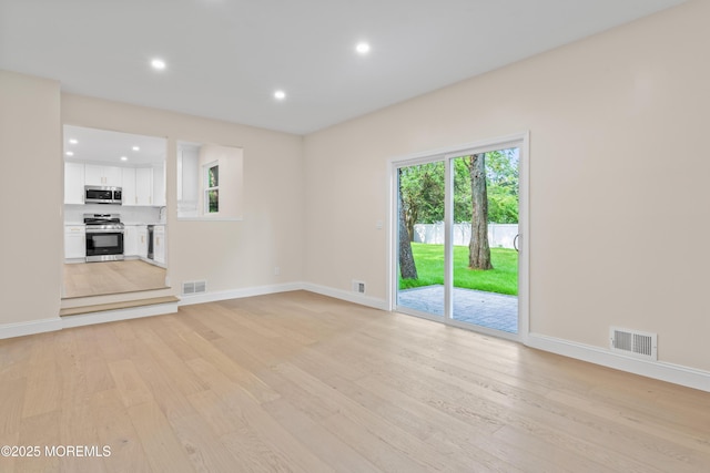 5 Rose St, Lincroft, NJ 07738 - unfurnished living room with light wood-type flooring, baseboards, and recessed lighting