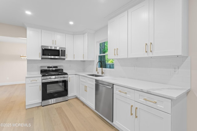 5 Rose St, Lincroft, NJ 07738 - kitchen featuring appliances with stainless steel finishes, light wood-style flooring, a sink, backsplash, and recessed lighting