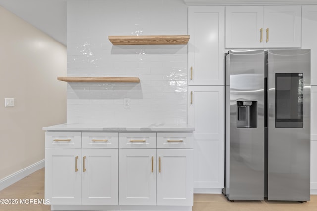 5 Rose St, Lincroft, NJ 07738 - kitchen with stainless steel fridge, backsplash, baseboards, white cabinets, and light wood finished floors