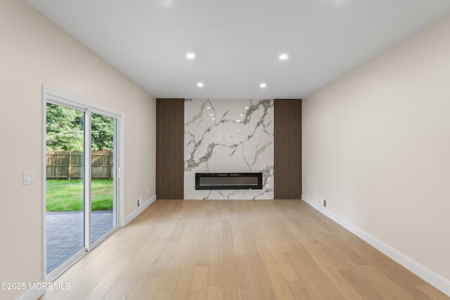 5 Rose St, Lincroft, NJ 07738 - unfurnished living room featuring recessed lighting, a high end fireplace, light wood-style flooring, and baseboards