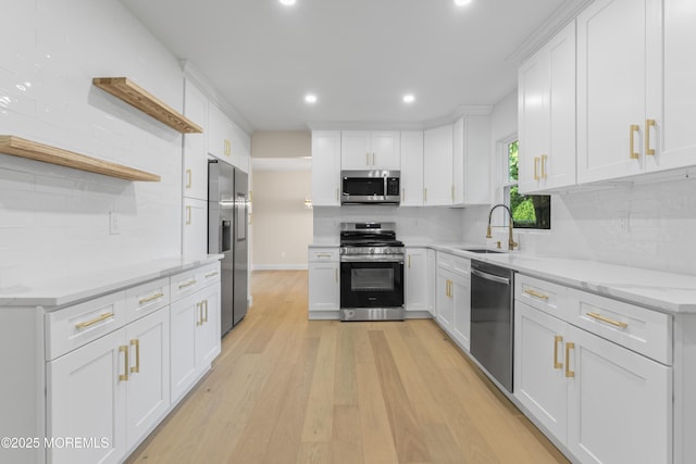 5 Rose St, Lincroft, NJ 07738 - kitchen featuring appliances with stainless steel finishes, a sink, open shelves, backsplash, and light wood-type flooring