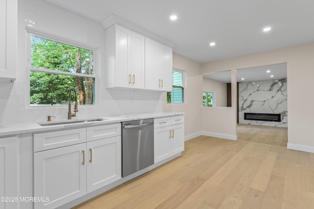5 Rose St, Lincroft, NJ 07738 - kitchen featuring dishwasher, a sink, light wood-style floors, light countertops, and white cabinets